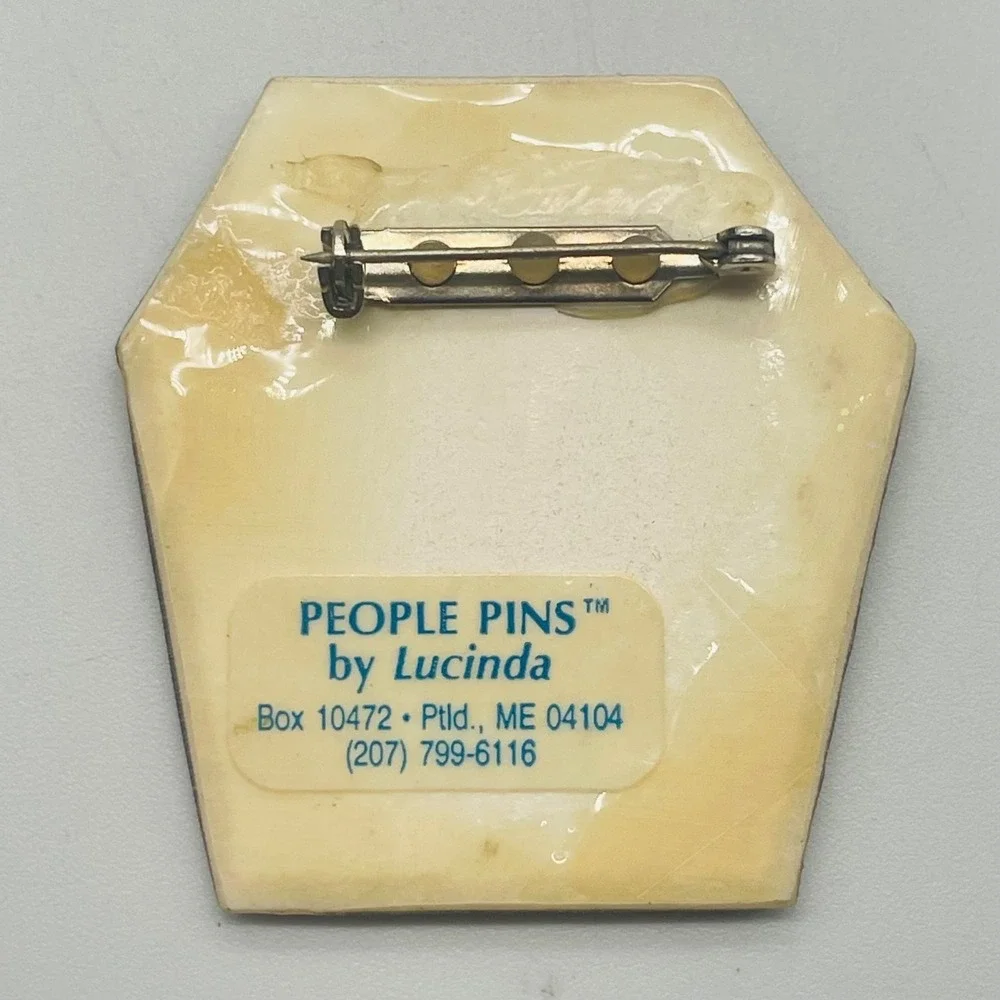 • Hand-painted Lucinda People Pins brooch featuring a whimsical celebration scen